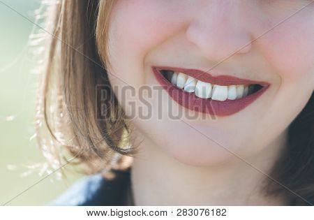 Beautiful Girl With Cherry Red Lips And White Teeth Is Smiling