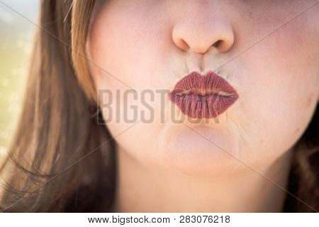 Cherry Red Lips Of Young Girl Are Kissing