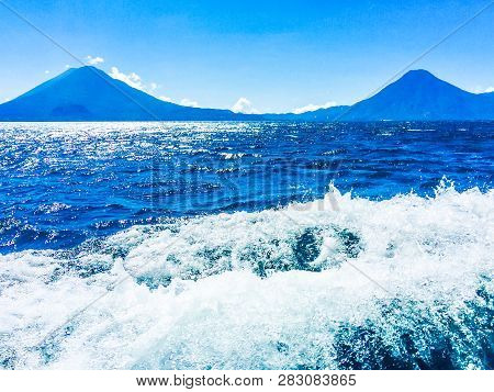 Atitlan, Toliman & San Pedro Volcanoes Viewed From Boat On Lake Atitlan In Guatemalan Highlands, Cen
