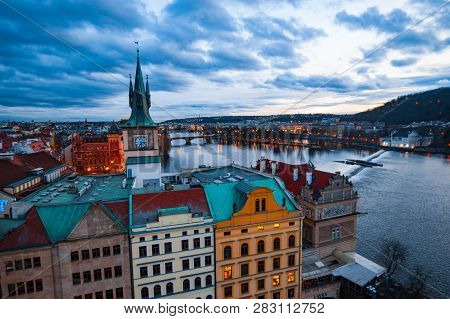 View Of The Roofs, Vltava And Bridges In Prague. Stare Misto. Sunset