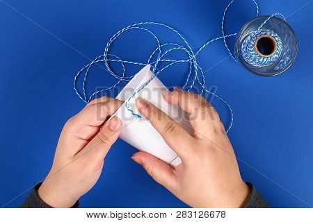 Diy Pencil Holder Plastic Glass Sour Cream, Yogurt Wrapped Thread Blue Background. Decoration Flower