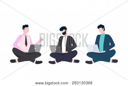 Men In Casual Clothes Sitting Cross-legged With Laptops. People Using And Looking At Computer, Workt