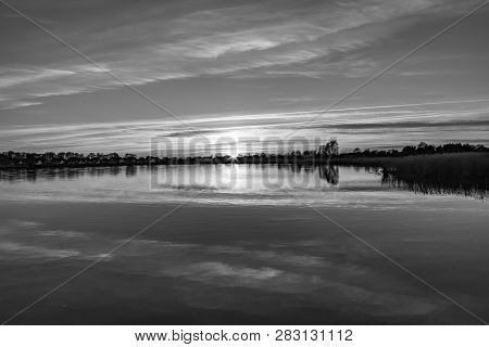 Sunset In Zinnowitz With Reflection Of The Backwater