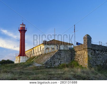 The Farol De Esposende (esposende Lighthouse) Set In Front Of The Fort Of Sao Joao Baptista De Espos
