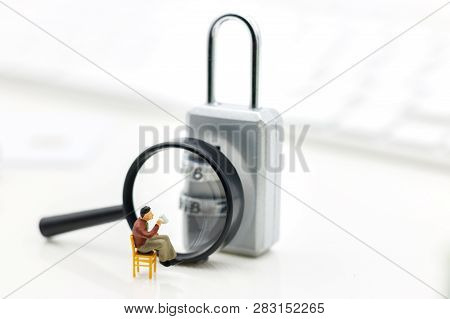 Miniature People Are Decrypting Unlock Padlock, Decrypt The Key. Concept For Data Security Breach, R