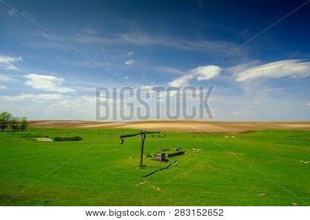 Shadoof On The Pasture Landscape