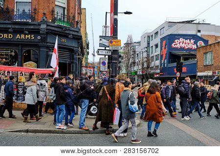 LONDON, UK - DECEMBER 30, 2018: Visitors at Camden High St. Camden Market and streets nearby are the fourth-most popular attraction in the city, attracting approximately 100,000 people each weekend