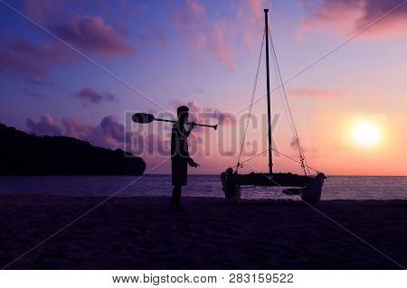 Hobie Cat Or Catamaran On The Beach At Beautiful Sunrise Early Morning, Silhouette Asian Man With Pa