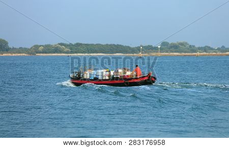 Large Barge For Transporting Goods In The Venice Lagoon On The Adriatic Sea In Northern Italy