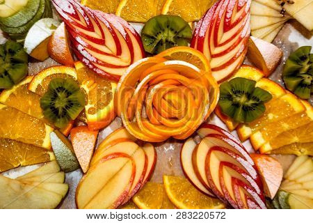 Fruit salad of kiwi, orange, citrus and Apple in vegetarian restaurant. Vitamin Breakfast and fresh fruit salad for a healthy lifestyle.