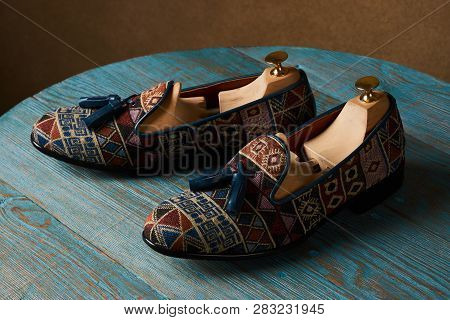 Fashionable Casual Mens Shoes On Wodden Table, Close-up