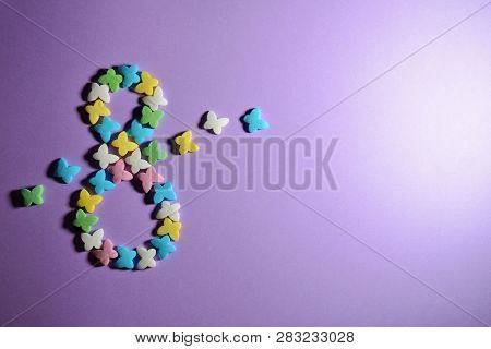 Sugar Colored Butterflies On A Purplebackground, In Shape Of Number Eight, Concept Of Spring And Mar
