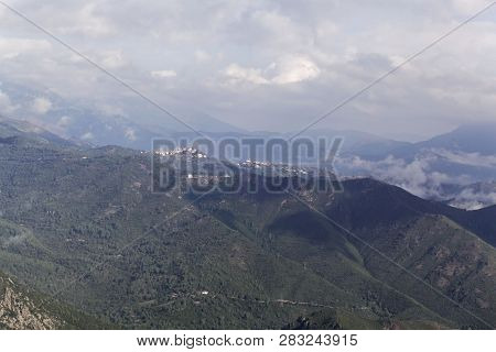 Mountains With Clouds In Central Corsica, France.