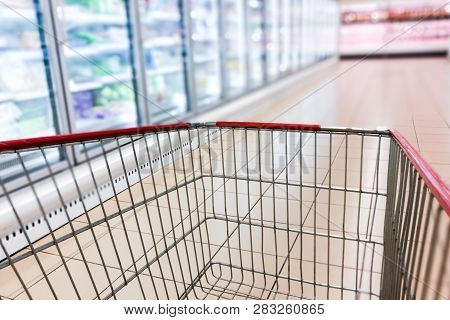 Perspective View Shopping Trolley Cart  At Supermarket Chiller Frozen Aisle