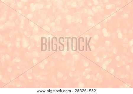 Coral Blurry Abstract Background. Bokeh Lights Toned In Trendy Pastel Color