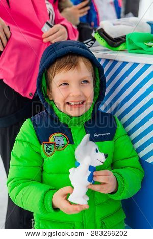 Sheregesh, Kemerovo Region - April 6, 2018. Boy Holding U-laika Symbol Of Universiade 2019 Souvenir 