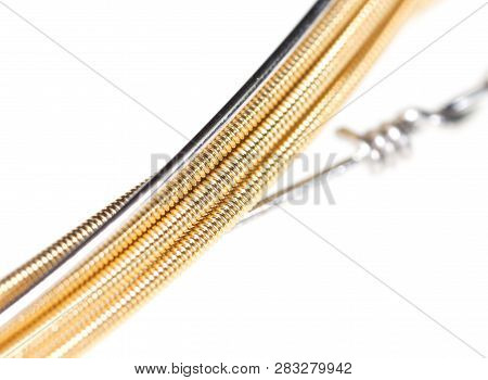 Strings For Guitar Isolated On A White Background. Macro