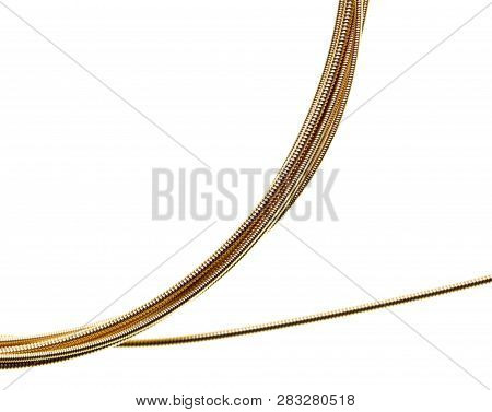 Strings For Guitar Isolated On A White Background. Macro
