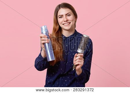 Cheerful Young Woman Advertises New Hairspray, Holds Comb, Wants To Change Image, Dressed In Stylish
