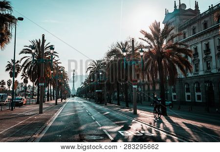 Backlighting View Of Passeig De Colom And The Columbus Statue
