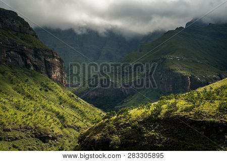 Dramatic Afternoon Light Falls On The Hills Along The Tugela Gorge Hiking Route At The Base Of The A