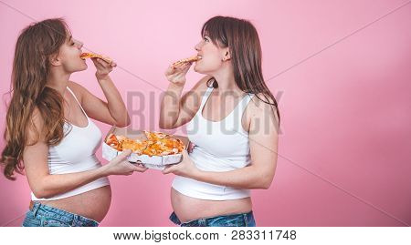 Nutrition Concept, Pregnant Women Eating Pizza On A Pink Background