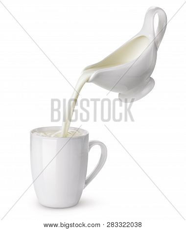 Pouring Cream From Creamer Into Cup With Splash Isolated On White Background, Flowing Milk