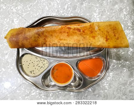 Masala Dosa And Idli Dosa Food Closeup With Selective Focus And Crop Fragment. It Is A Popular South
