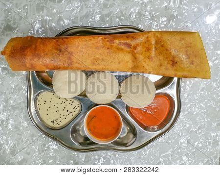Masala Dosa And Idli Dosa Food Closeup With Selective Focus And Crop Fragment. It Is A Popular South