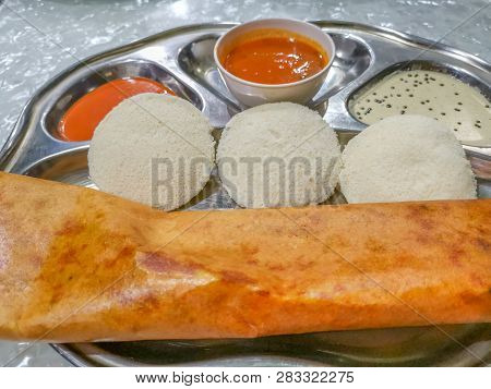 Masala Dosa And Idli Dosa Food Closeup With Selective Focus And Crop Fragment. It Is A Popular South