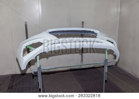 Repair Of The Rear Bumper Of A White Car After An Accident With The Help Of Multi-colored Putty In A