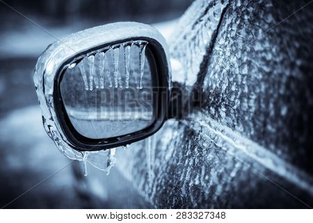 Close Up Shot Of A Frozen Car Mirror After Freezing Rain.