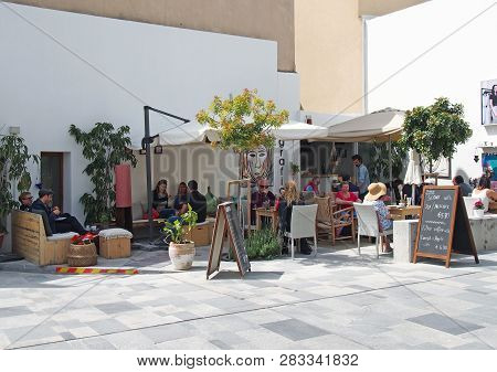 Paphos, Cyprus - March 17, 2018: Tourists And Locals At The Grafico Cafe In The Old Town Area Of Pap