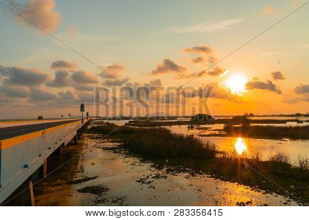 Sunset At The Long Bridge Across Wetland The Talay Noi Wetlands Preserve In Phatthalung At 450 Squar