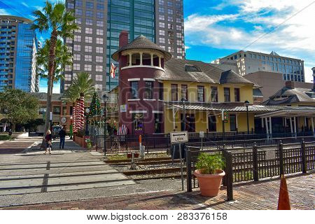 Orlando, Florida . December 24, 2018. Old Train Station In Church Street And Modern Buildings On Lig