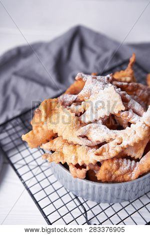 Brushwood - Russian Traditional Cookies With Powdered Sugar. Food Consept. Plate With Hvorost On Whi