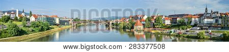 Maribor, Slovenia - May 20, 2018: Panorama Of Maribor City, Slovenia. Drava River, Buildings And Alp