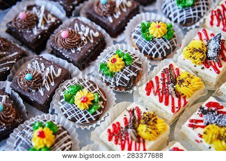 Assortment Of Pieces Of Cake On Table, Copy Space. Several Slices Of Delicious Desserts, Restaurant 