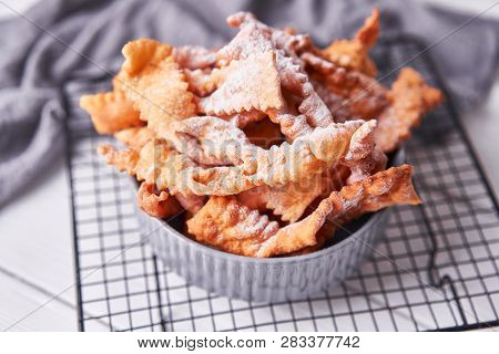 Brushwood - Russian Traditional Cookies With Powdered Sugar. Food Consept. Plate With Hvorost On Whi