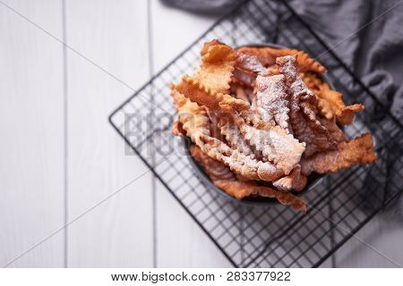 Brushwood - Russian Traditional Cookies With Powdered Sugar. Food Consept. Plate With Hvorost On Whi