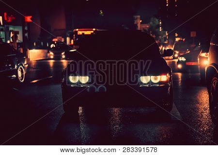 Night View Of The Cars. Road In The City At The Night With Yellow And Red Electrical Light For Cars 