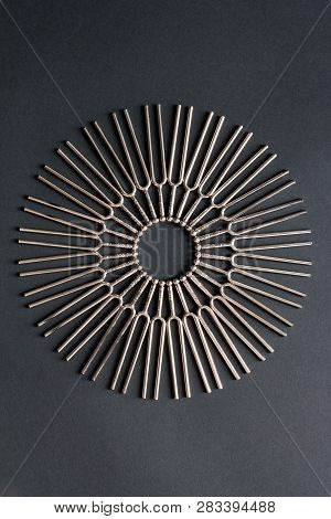 Tuning Fork Round Pattern On A Black Background
