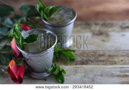 Image For Kentucky Derby In May Showing Two Silver Mint Julep Cups With Crushed Ice And Fresh Mint I