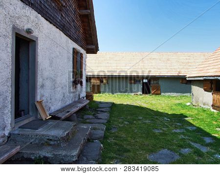 Alpine Livestock Farms And Stables On The Slopes Of Alvier Mountain In The Appenzell Alps Mountain R