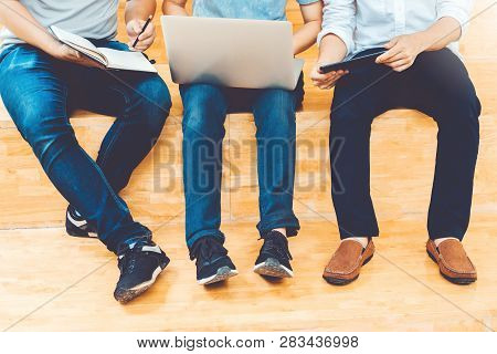 High School Or College Students Studying And Reading Together In Library