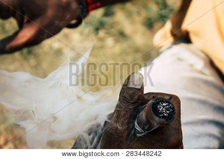 Varanasi India November 19, 2018 View Of A Unknown Sadhu Smoking A Chillum In The Streets Of Varanas