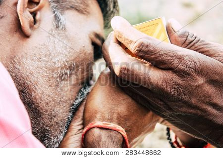 Varanasi India November 19, 2018 View Of A Unknown Sadhu Smoking A Chillum In The Streets Of Varanas
