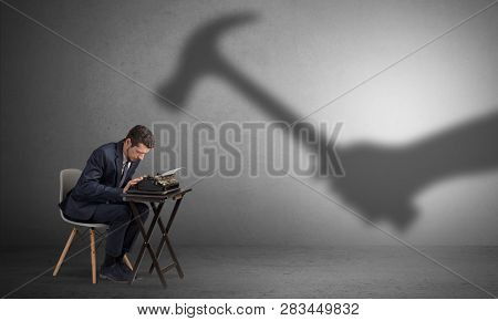 Shadow threatening hard worker man who is afraid