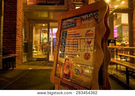 DUSSELDORF, GERMANY - CIRCA SEPTEMBER, 2018: outdoor poster stand at a bar in Dusseldorf.