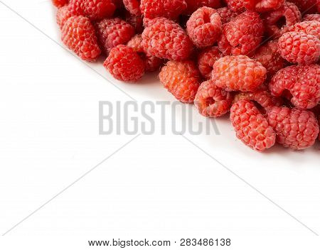 Background Of Raspberries. Fresh Raspberries Closeup On White Background. Top View. Background Of Re